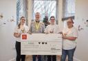 The £1,500 cheque with Dean Jeffrey and members of the RMHC