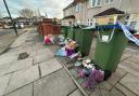 Floral tributes at scene of the stabbing on Penhill Road