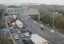 There are traffic queues and delays following a crash on the M25 near the Dartford Crossing.