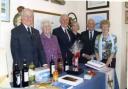 Air Commander John Bell (centre), chairman of the Biggin Hill Branch of the RAF Association, with anniversary guests