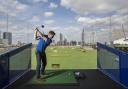 Tee off towards the City at stunning driving range next to the O2 at Greenwich