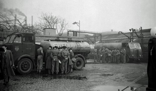 News Shopper: 1953. Soldiers being shown the operation of tankers at the St. Leonard's Wharf heavy oil depot in Poplar, east London. PA/PA Wire 