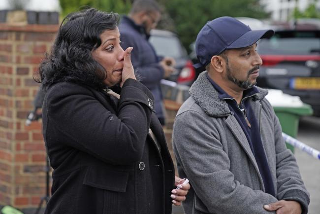Relatives at the scene of a house fire on Hamilton Road in Bexleyheath (PA)