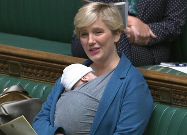 Labour MP Stella Creasy speaking in the chamber of the House of Commons, in London, with her newborn baby strapped to her. Credit: PA