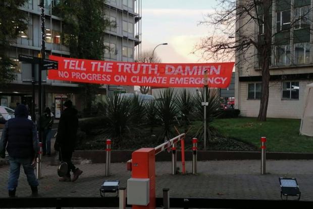 News Shopper: A banner was erected outside the building (Climate Camp Lewisham)