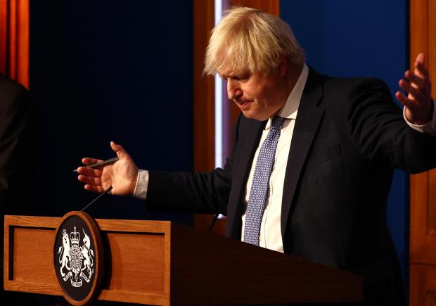 News Shopper: Prime Minister Boris Johnson gestures whilst speaking at a press conference in London's Downing Street (PA)
