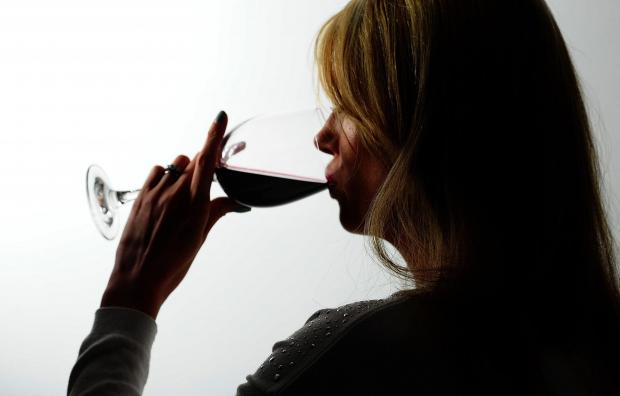 News Shopper: A woman drinking red wine. Credit: PA
