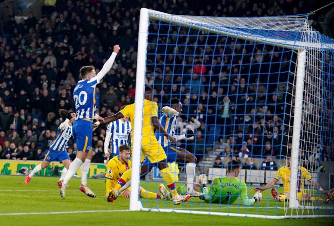Crystal Palace's Joachim Andersen scores an own goal during the Premier League match at the AMEX Stadium, Brighton.