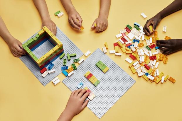 News Shopper: Children playing with LEGO. Credit: PA