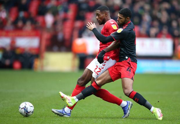 News Shopper: Charlton Athletic's Chuks Aneke (left) and Fleetwood Town's Zak Jules battle for the ball during the Sky Bet League One match at The Valley, London.