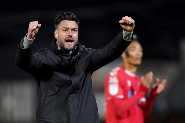 Charlton Athletic manager Johnnie Jackson celebrates at full time after the Sky Bet League One match at the Abbey Stadium, Cambridge