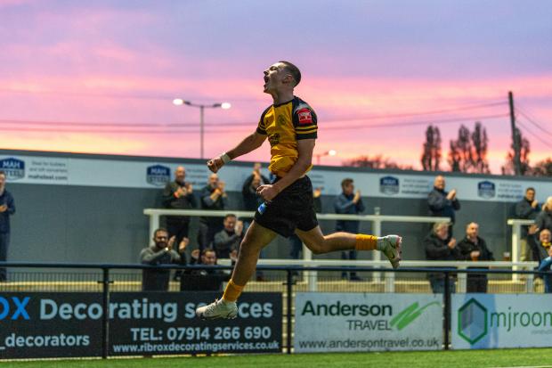 Soul Kader celebrates putting Cray Wanderers 2-0 up against East Thurrock as night starts to fall at Hayes Lane. Pic: Jon Hilliger/www.hilligerpix.com