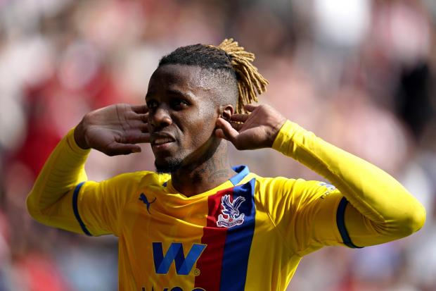 News Shopper: Crystal Palace's Wilfried Zaha celebrates scoring their side's second goal of the game during the Premier League match at St Mary's Stadium, Southampton