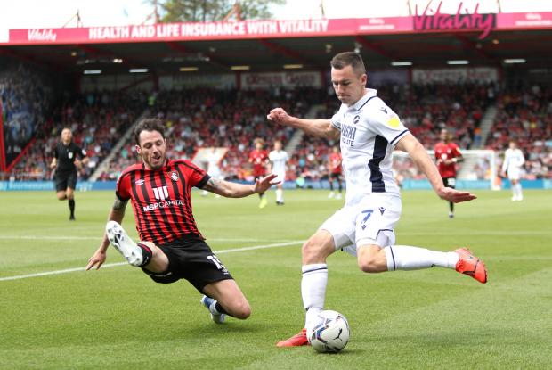 News Shopper: Bournemouth's Adam Smith (left) and Millwall's Jed Wallace battle for the ball during the Sky Bet Championship match at the Vitality Stadium, Bournemouth