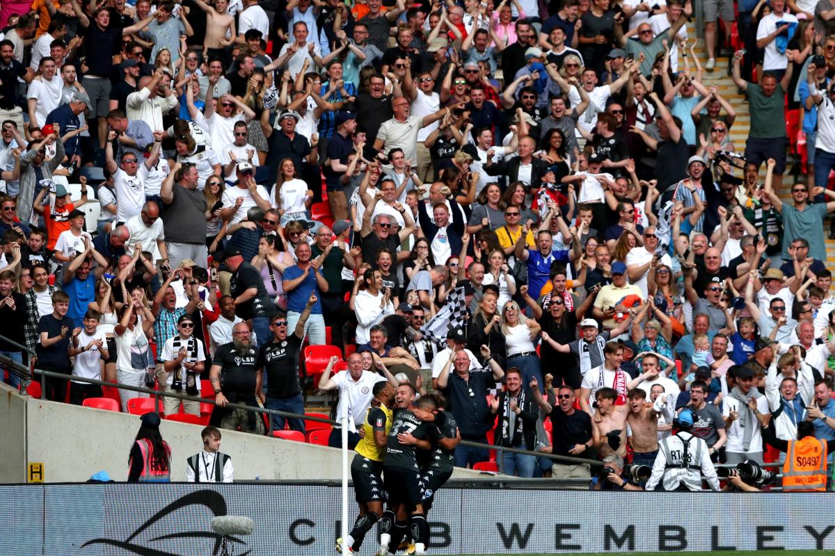 Bromley's Michael Cheek celebrates with his team-mates after scoring their side's first goal of the game during the Buildbase FA Trophy final at Wembley Stadium, London