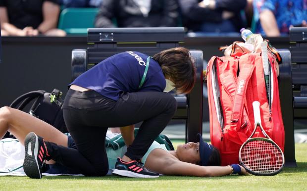 News Shopper: Emma Raducanu receives treatment for an injury during a medical time out in her match against Viktorija Golubic on day four of the Rothesay Open 2022 at Nottingham Tennis Centre