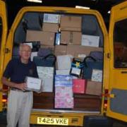 Biggin Hill & Westerham Lions Club secretary Keith Nixon starts to unload the club's minibus at the district warehouse