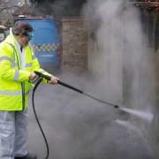 Mayor of Lewisham Sir Steve Bullock cleans graffiti