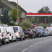 Motorists queue for fuel at an ESSO petrol station in Ashford, Kent. (Gareth Fuller/PA)