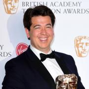 Michael McIntyre with a BAFTA. Credit: PA