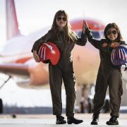 Olivia Joohee-Riddington, aged 9 and Rei Diec, aged 7 during filming of a parody of the movie Top Gun at Luton airport as part of easyJet's nextGen recruitment campaign. Credit: PA/ easyJet