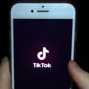 TikTok app on a phone screen. Credit: PA