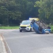 Picture shows a car on its roof in Chislehurst