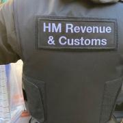 An HMRC officer seizes evidence