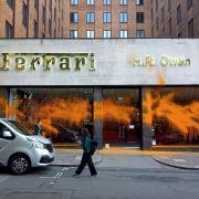 Protesters began spraying paint from a fire extinguisher over the premises of high-end dealers Ferrari and Bentley on the corner of Berkeley Square and Bruton Street