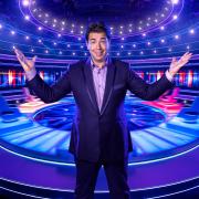 The game show features a spinning wheel of celebrity experts who help the contestants answer trivia questions. (Gary Moyes/BBC/PA)