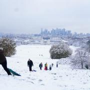 People sledging in the snow Greenwich Park, London. Snow and ice have swept across parts of the UK, with cold wintry conditions set to continue for days