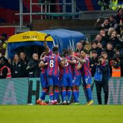 Crystal Palace players celebrate James Tomkins' goal against Brighton