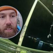 The two men ascended almost 200ft high up the Queen Elizabeth II Bridge