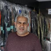 Ahmed Afama poses in the Abbey Wood dry cleaners in Abbey Wood in London (photo: Facundo Arrizabalaga/MyLondon)