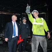 The mayor checks out the damage at Poundmart