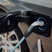 Photo of electric charging on  an EV- Taken by CHUTTERSNAP (Unsplash)
