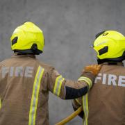 A fire under a bridge on a busy road in Abbey Wood which led to closures is under investigation.