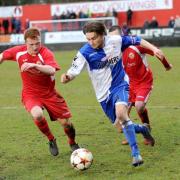 E&B striker Alfie May (right) goes on the attack