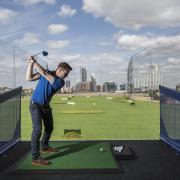 Tee off towards the City at stunning driving range next to the O2 at Greenwich
