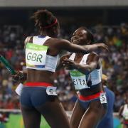 Dina Asher-Smith and Daryll Neita embrace after clincing relay medals | Pictures: Martin Rickett/PA Wire