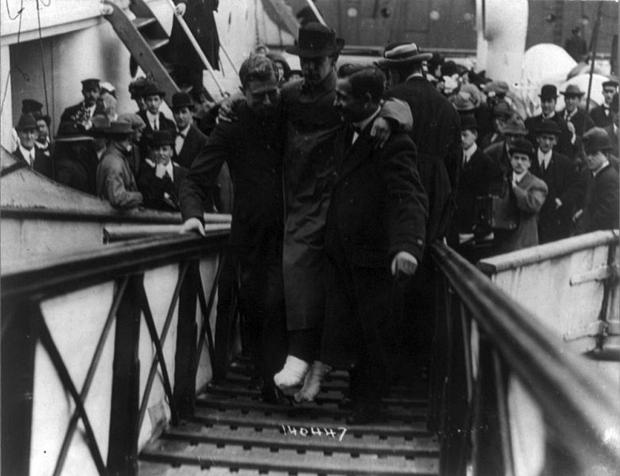 News Shopper: Harold Bride, one of the radio operators aboard the Titanic, is pictured being carried to safety. He lived in Shortlands