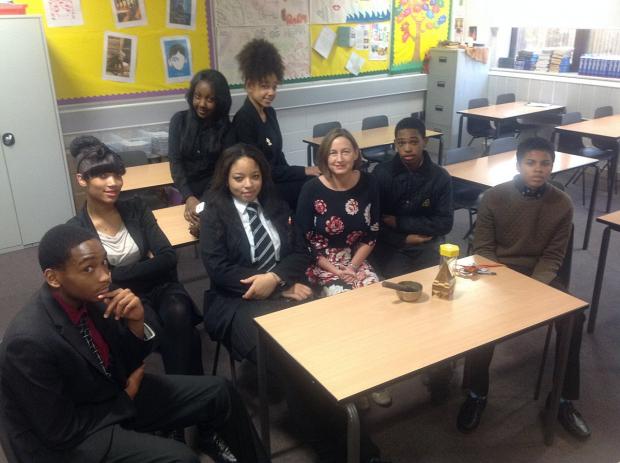News Shopper: Fidelma Hanlon pictured with Year 11 pupils at Trinity School and a meditation gong