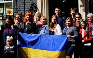 A number of Ukrainian families stand on the doorstep of 10 Downing Street after they met with Prime Minister Boris Johnson after arriving to the UK through the UK visa scheme (image - PAMEDIA)