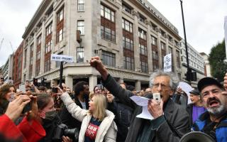 The brother of former Labour leader Jeremy Corbyn, Piers Corbyn, speaks to protesters during an anti-lockdown rally on Oxford Street, London