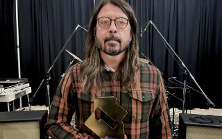 Dave Grohl of the Foo Fighters with their Official Number 1 Album Award from the Official Charts Company for Medicine at Midnight. Picture: PA/Official Charts Company